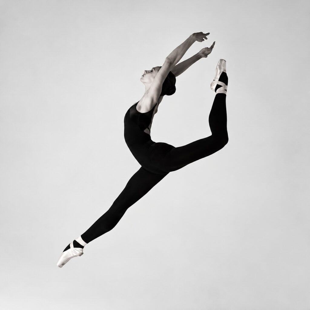 Ballet dancer performing a leap with lumbar extension.