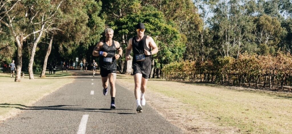 Lachlan Gillies running during a marathon after returning to running after injury.